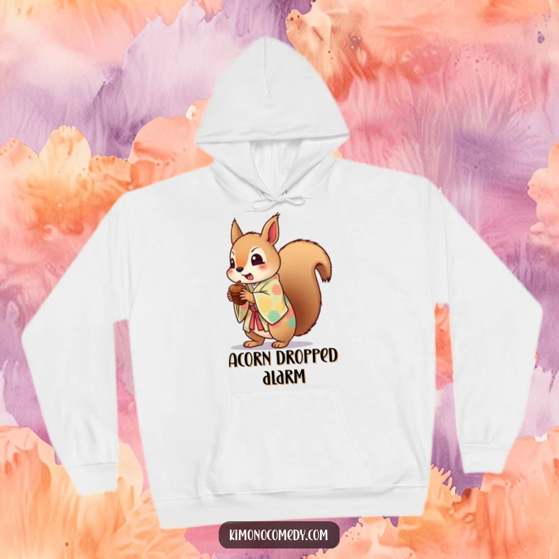 Funny hoodie depicting a startled kawaii squirrel in a vibrant kimono, accidentally dropping an acorn, embodying humorous surprise and clumsiness.