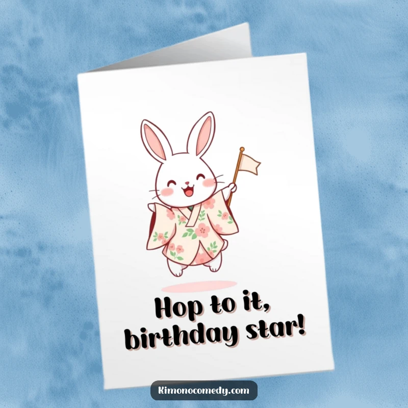 Funny Free Printable Birthday Card: A rabbit in a floral kimono excitedly hops and waves a small flag.