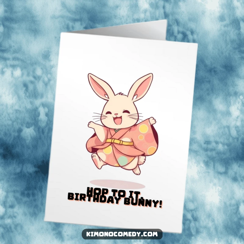 Funny Free Printable Birthday Card: A rabbit in a colorful kimono joyfully leaps, spreading birthday cheer with a playful expression.