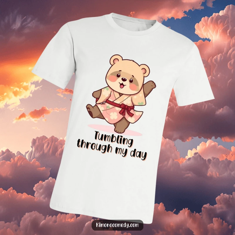 Funny cotton t-shirt featuring a playful bear cub in a vibrant kimono, hilariously attempting a cartwheel with adorable, uncoordinated flair.