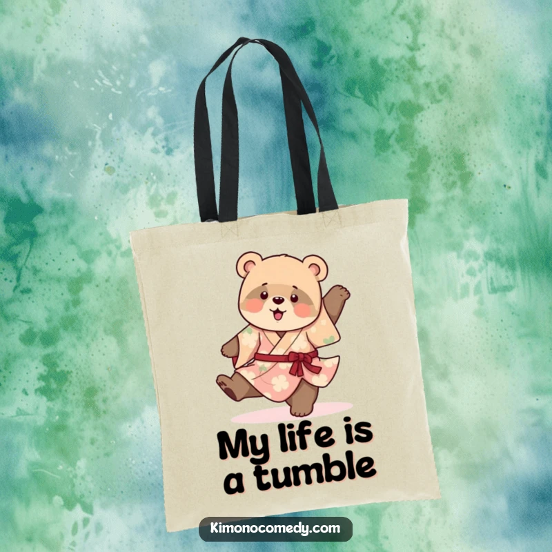 Funny canvas tote bag featuring a playful bear cub in a vibrant kimono, attempting a clumsy cartwheel, perfect for carrying essentials with charm.